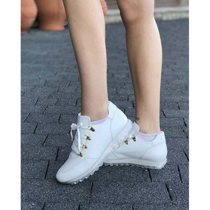 White sports shoes on rubber sole