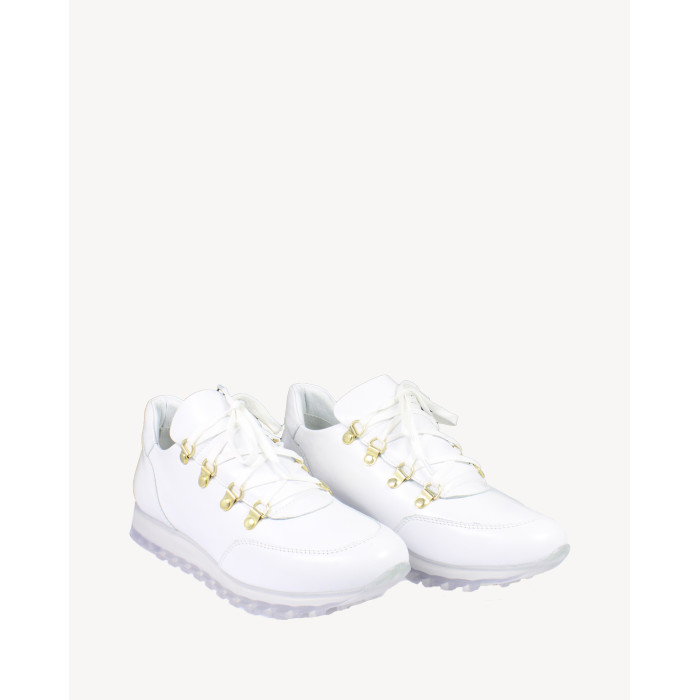 White sports shoes on rubber sole