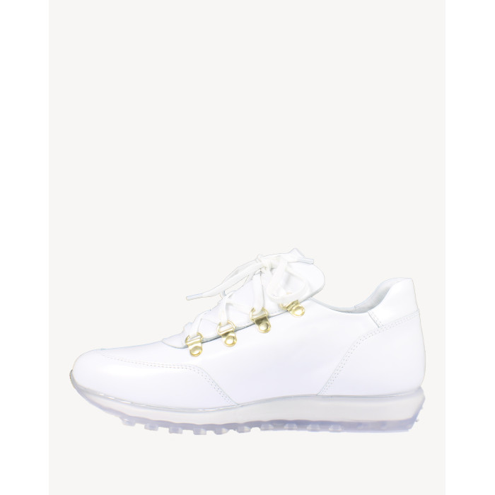 White sports shoes on rubber sole