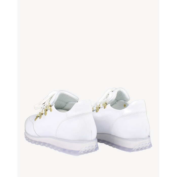 White sports shoes on rubber sole