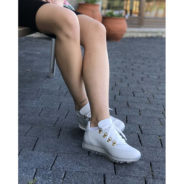 White sports shoes on rubber sole