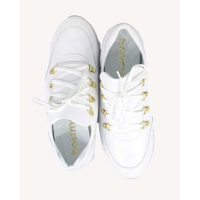 White sports shoes on rubber sole