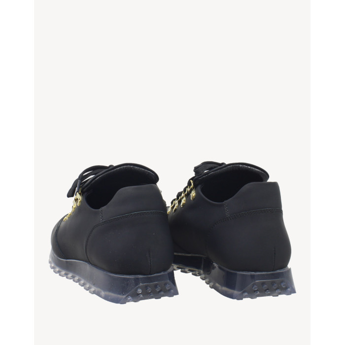 Black sports shoes on rubber sole