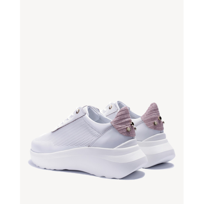 White sports shoes with openwork upper grain leather