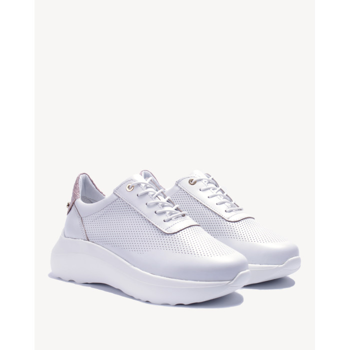 White sports shoes with openwork upper grain leather