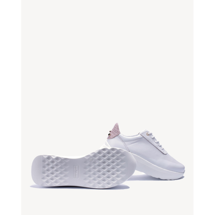 White sports shoes with openwork upper grain leather