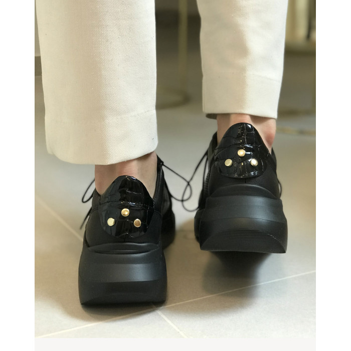 Black sport shoes with openwork upper grain leather