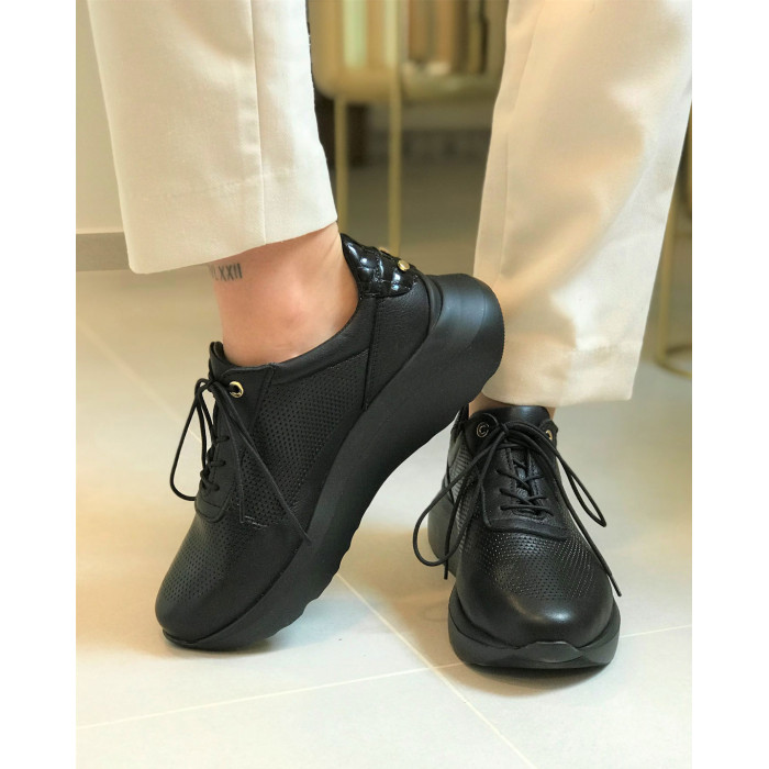 Black sport shoes with openwork upper grain leather