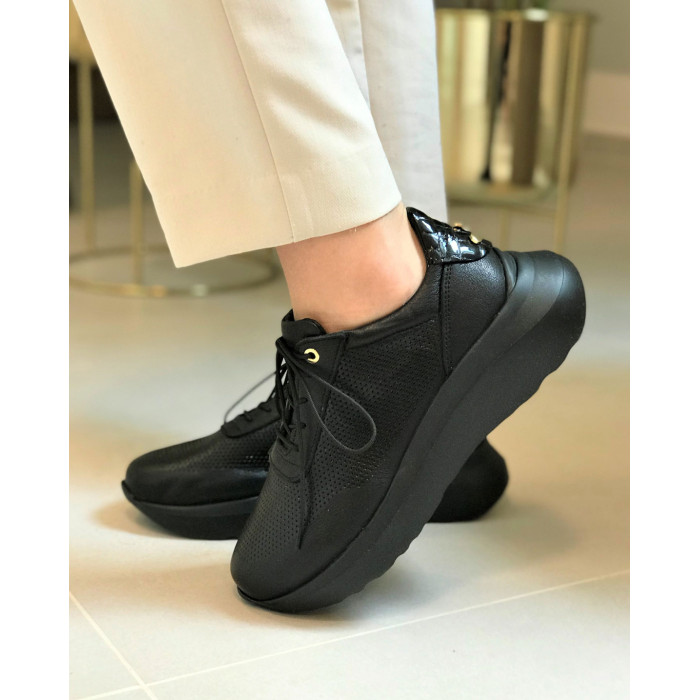 Black sport shoes with openwork upper grain leather
