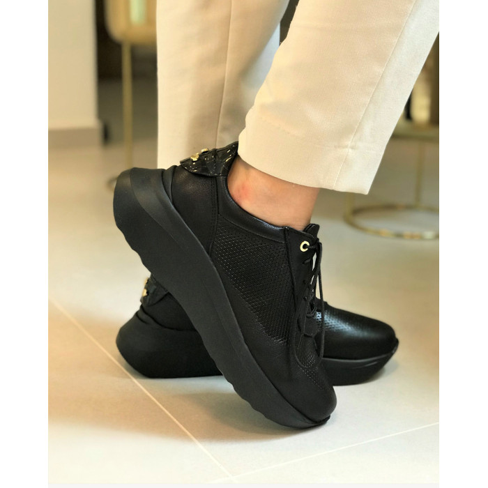 Black sport shoes with openwork upper grain leather