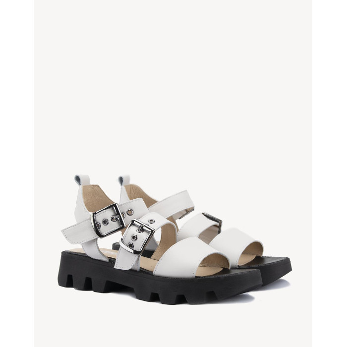 White leather sandals on a black sole
