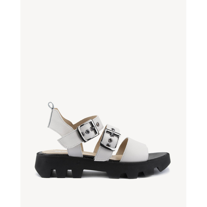 White leather sandals on a black sole