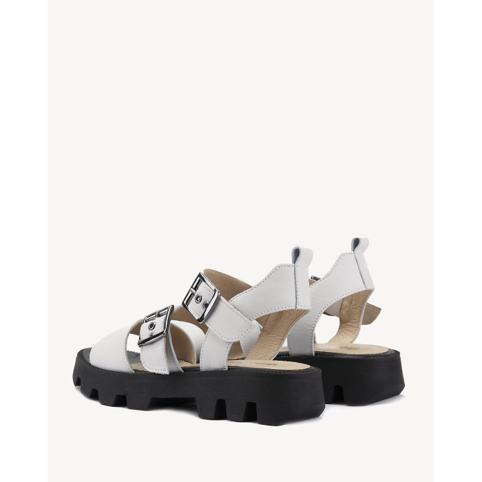 White leather sandals on a black sole