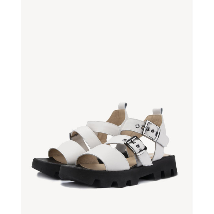 White leather sandals on a black sole