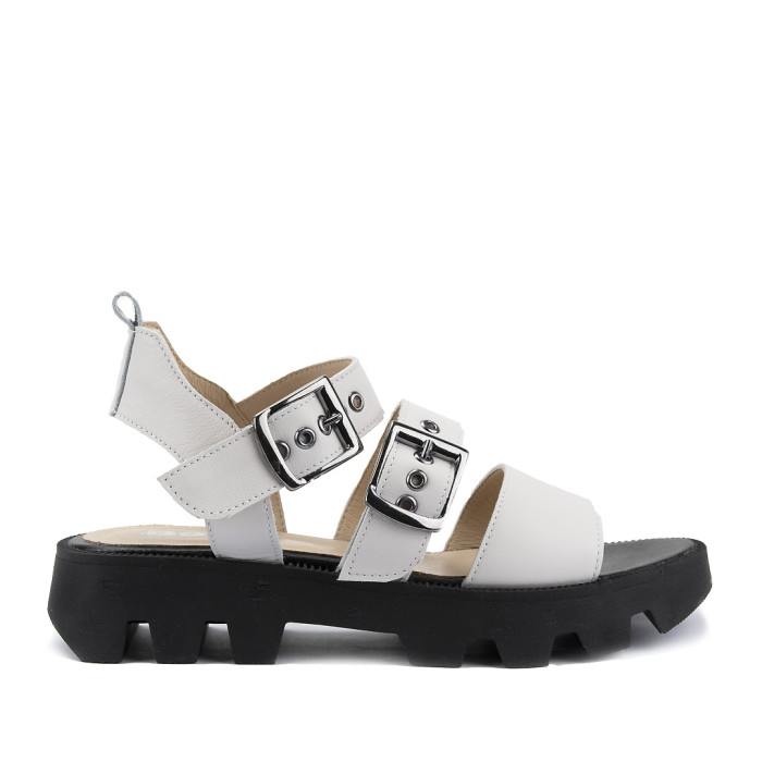 White leather sandals on a black sole