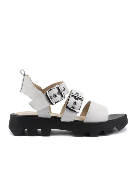 White leather sandals on a black sole