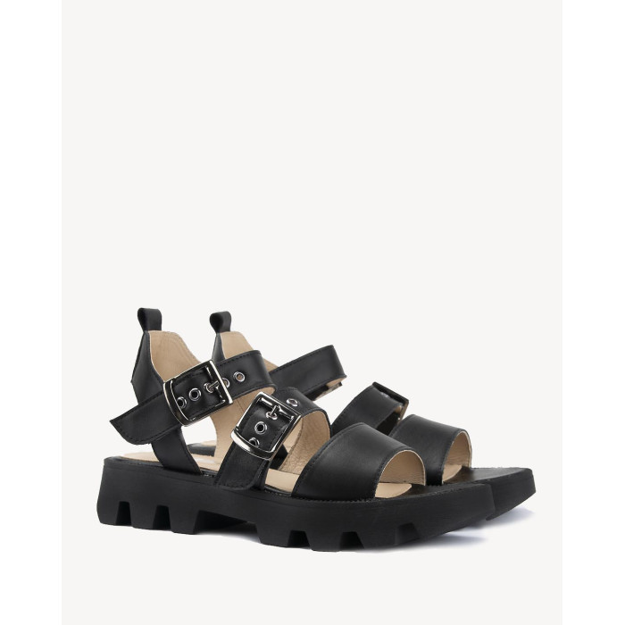 Black leather sandals on a black sole