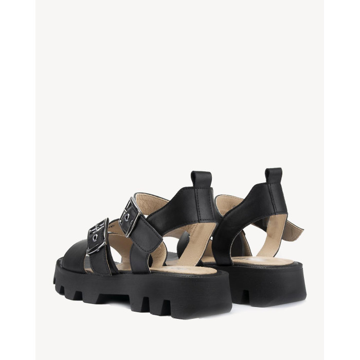 Black leather sandals on a black sole