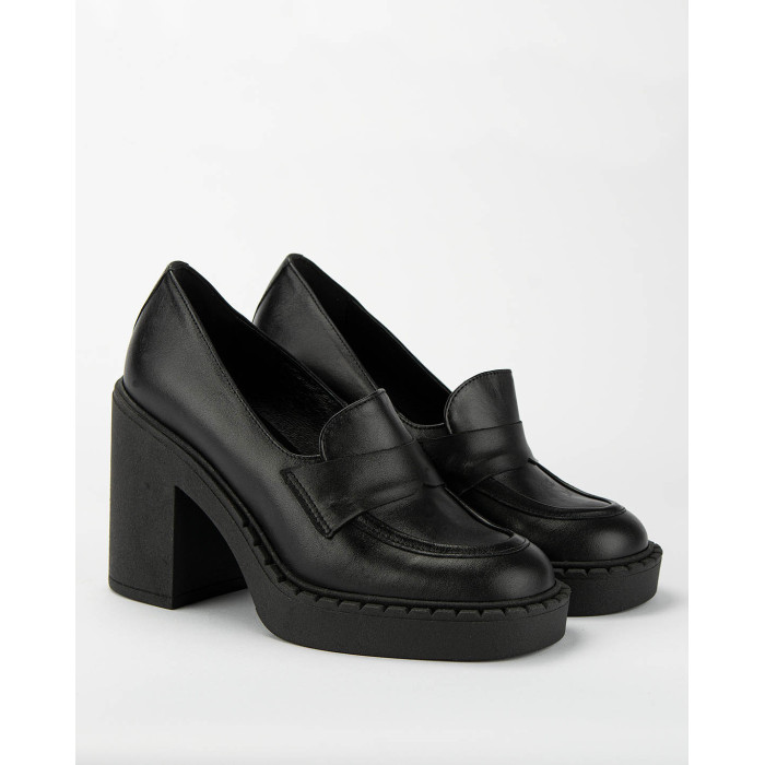 Black leather pumps on a thick sole