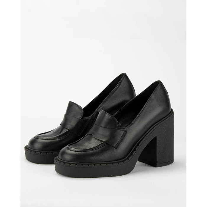 Black leather pumps on a thick sole