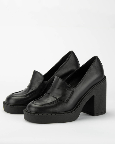 Black leather pumps on a thick sole