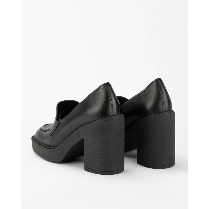 Black leather pumps on a thick sole