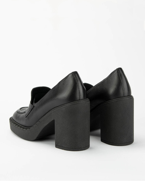 Black leather pumps on a thick sole