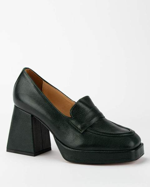 Dark green leather pumps on...