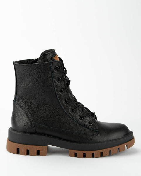 Black insulated leather boots on a platform