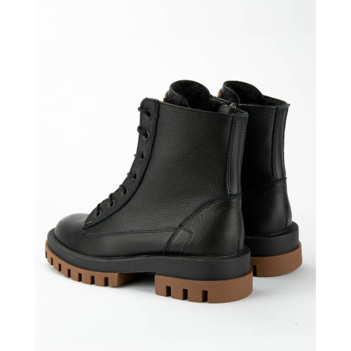 Black insulated leather boots on a platform