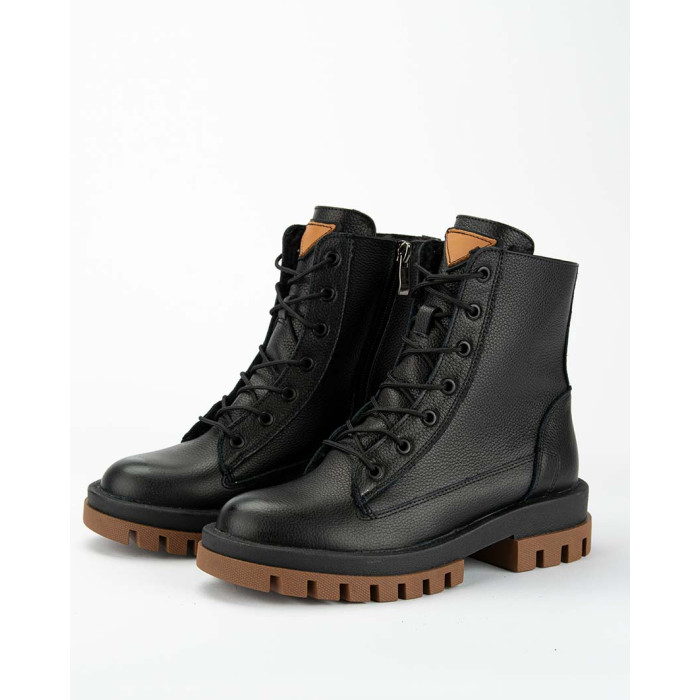 Black insulated leather boots on a platform
