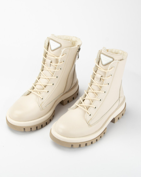 Beige, insulated leather boots on a platform