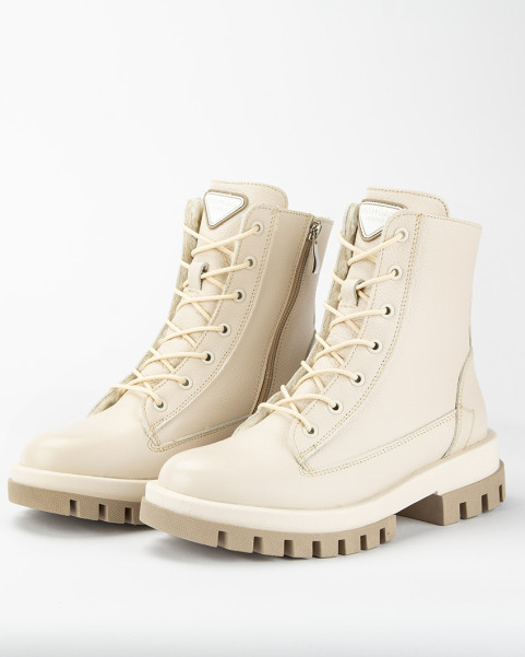 Beige, insulated leather boots on a platform