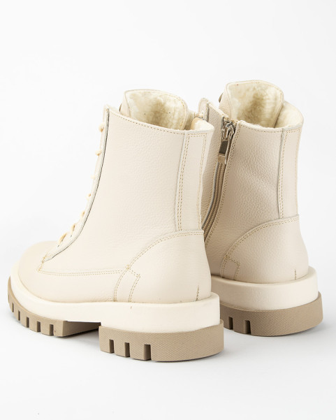 Beige, insulated leather boots on a platform