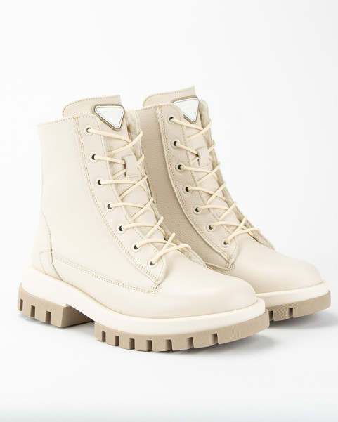 Beige, insulated leather boots on a platform