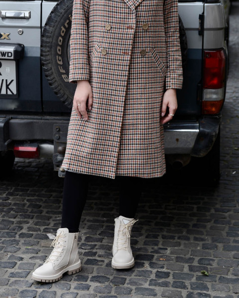 Beige, insulated leather boots on a platform