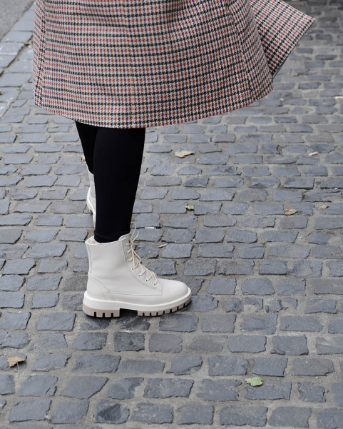 Beige, insulated leather boots on a platform