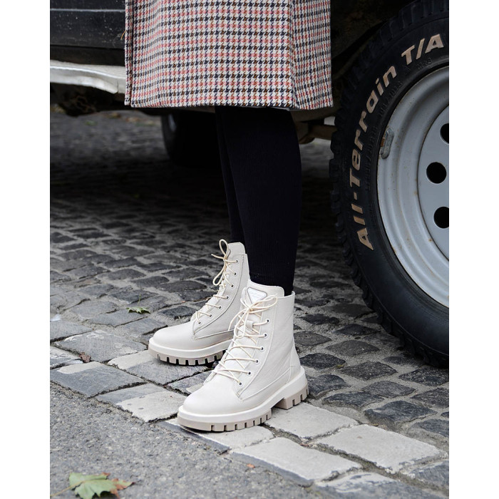 Beige, insulated leather boots on a platform