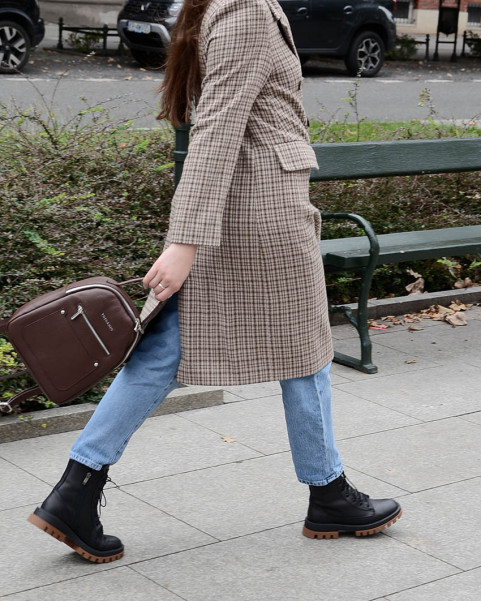 Black insulated leather boots on a platform