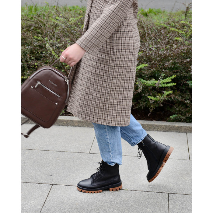 Black insulated leather boots on a platform