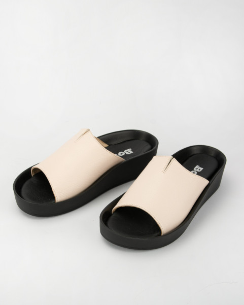 Beige leather flip-flops on black sole