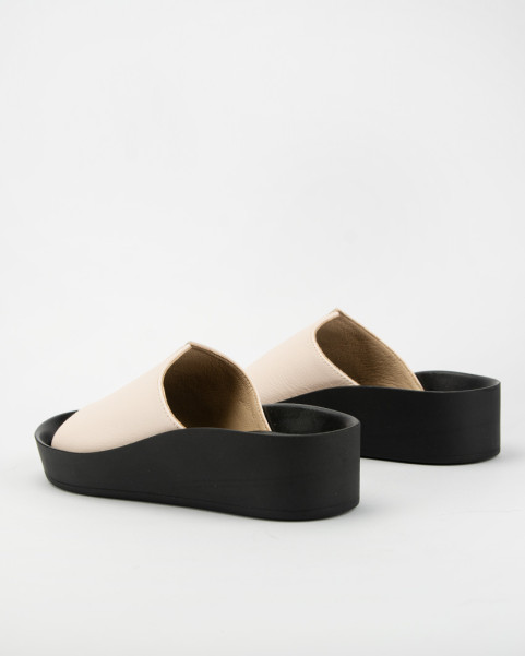 Beige leather flip-flops on black sole