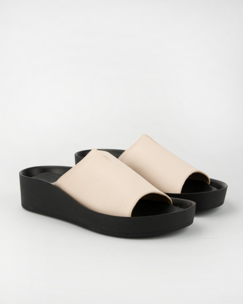 Beige leather flip-flops on black sole