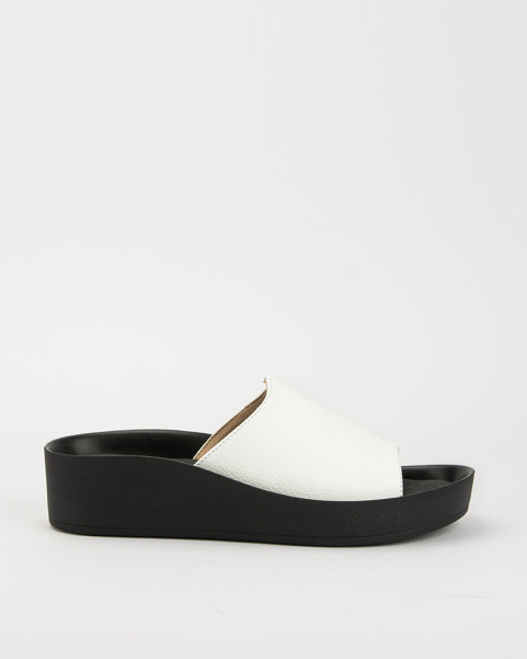 White leather flip-flops on a black sole