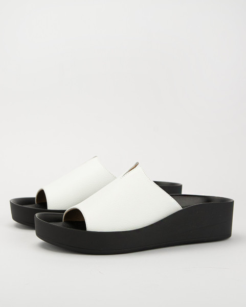 White leather flip-flops on a black sole