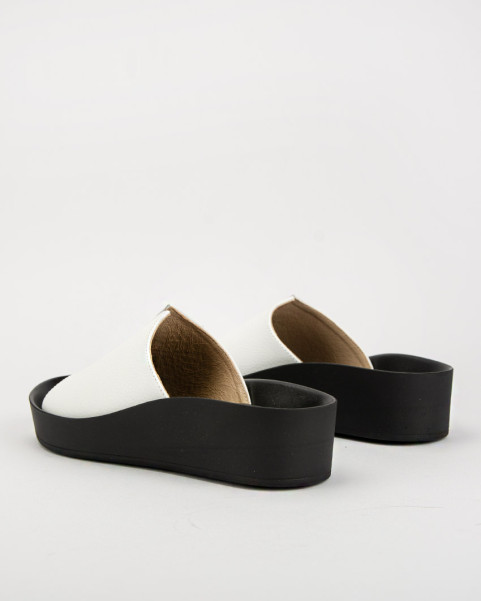 White leather flip-flops on a black sole