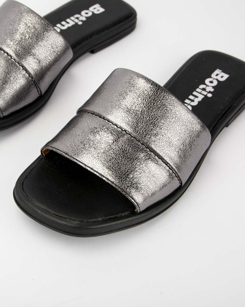 Silver flip-flops on a flat sole